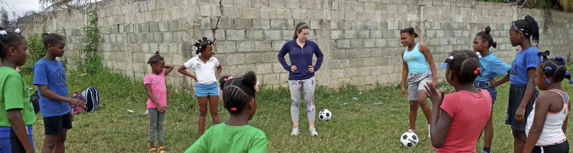 Katie Baird pictured at a soccer practice with girls from the two local schools Lafwa ran