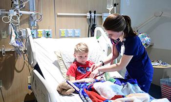 Nurse caring for a child in hospital